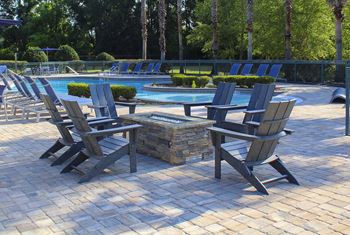 Pool-side fire pit with conversational seating area